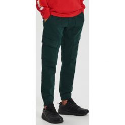 Spodnie slim jogger - Turkusowy. Niebieskie spodnie męskie Cropp, m, bez wzorów. Za 139,99 zł.