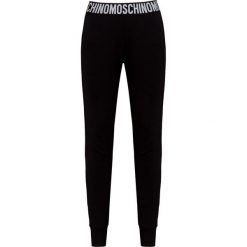 Spodnie dresowe MOSCHINO UNDERWEAR. Czarne spodnie damskie Moschino Underwear, z bawełny. W wyprzedaży za 573,00 zł.