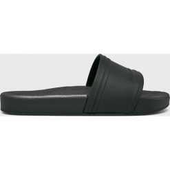 Melissa - Klapki Slide + Rider. Czarne klapki damskie Melissa, bez wzorów, z materiału, bez obcasa, na obcasie. W wyprzedaży za 219,90 zł.