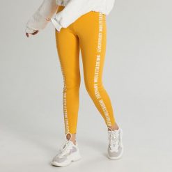 Legginsy z napisem - Żółty. Żółte legginsy damskie Cropp, s, z napisami. Za 59,99 zł.