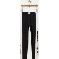 OVS - Legginsy dziecięce 146-170 cm. Czarne spodnie dziewczęce OVS, z aplikacjami, z elastanu. Za 79,90 zł.