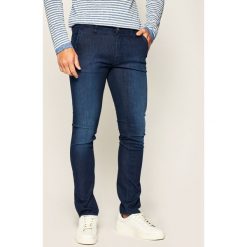 Jeansy Skinny Fit Guess Adam M02A81 D3ZO2. Niebieskie jeansy męskie Guess, m, z aplikacjami, z jeansu. W wyprzedaży za 289,00 zł.