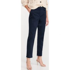 Spodnie chino - Granatowy. Niebieskie spodnie damskie Reserved. Za 89,99 zł.