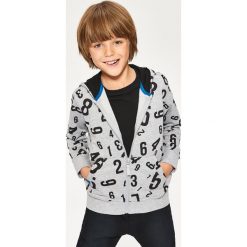 Bluza z kapturem - Jasny szar. Szare bluzy chłopięce rozpinane marki DOMYOS. Za 69,99 zł.