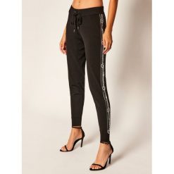 Spodnie dresowe MICHAEL Michael Kors Fashion Basics MU03HE6BVC. Czarne spodnie damskie MICHAEL Michael Kors, l, z dresówki. Za 879,00 zł.