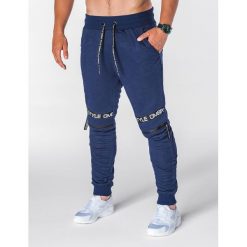 SPODNIE MĘSKIE DRESOWE P637 - GRANATOWE. Niebieskie spodnie dresowe męskie marki Ombre Clothing, s, z aplikacjami, z bawełny. Za 49,00 zł.
