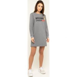 Sukienka dzianinowa Moschino Underwear & Swim A1714 9001. Czarne sukienki damskie Moschino Underwear & Swim, s, bez wzorów, z elastanu, bez kołnierzyka, bez rękawów. W wyprzedaży za 489,00 zł.