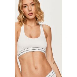 Guess Jeans - Biustonosz. Czarne biustonosze sportowe damskie Guess Jeans, s, z nadrukiem, z elastanu. Za 119,90 zł.