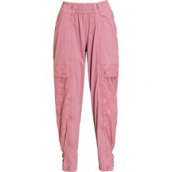 Spodnie ADIDAS BY STELLA McCARTNEY PERF TRACK PANTS. Różowe spodnie damskie adidas by Stella McCartney, z tkaniny. Za 710,00 zł.