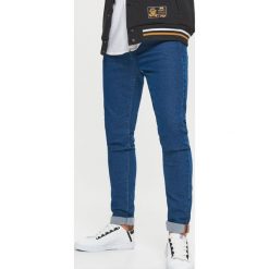 Jeansy SKINNY - Niebieski. Niebieskie jeansy męskie skinny marki Cropp. Za 89,99 zł.
