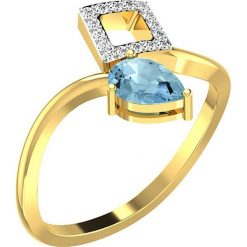 Złoty pierścionek z diamentami i syntetycznym akwamarynem. Żółte pierścionki damskie Art of Diamond & Co., z diamentem, złote. W wyprzedaży za 747,95 zł.
