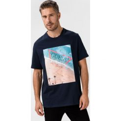 Guess Koszulka Niebieski. Niebieskie podkoszulki męskie Guess, xl, z nadrukiem, z bawełny, z krótkim rękawem. Za 159,95 zł.