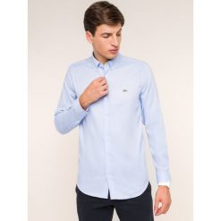 Koszula Lacoste CH2041. Niebieskie koszule męskie Lacoste, m, bez wzorów, casualowe, bez kołnierzyka, bez rękawów. W wyprzedaży za 269,00 zł.