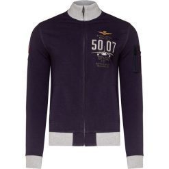 Bluza AERONAUTICA MILITARE. Białe bluzy męskie Aeronautica Militare, z haftami, militarne, ze stójką, bez rękawów, bez kaptura. Za 830,00 zł.