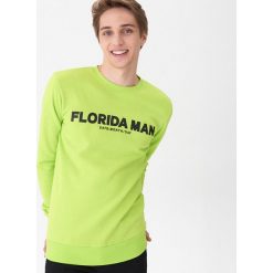 Bluza z nadrukiem - Zielony. Zielone bluzy męskie House, s, z nadrukiem, bez kołnierzyka, bez rękawów, bez kaptura. W wyprzedaży za 49,99 zł.