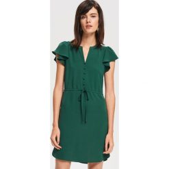 Sukienka mini z wiązaniem - Zielony. Zielone sukienki damskie marki Reserved, bez wzorów, bez kołnierzyka, bez rękawów, mini. Za 99,99 zł.