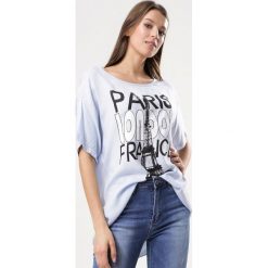 Niebieski T-shirt About Everything. Niebieskie bluzki damskie Born2be, xl, bez wzorów, bez kołnierzyka, bez rękawów. Za 39,99 zł.