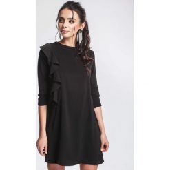 Czarna Sukienka Consign. Czarne sukienki damskie marki other, s, bez wzorów, z okrągłym kołnierzem, bez rękawów, mini, dopasowane. Za 79,99 zł.