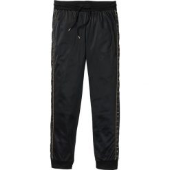 Spodnie sportowe trykotowe bonprix czarny. Czarne spodnie męskie bonprix, s, w paski, sportowe. Za 109,99 zł.