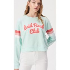 Bluza z kolorowym nadrukiem - Turkusowy. Niebieskie bluzy damskie Sinsay, xl, z nadrukiem, bez rękawów, bez kaptura. W wyprzedaży za 19,99 zł.