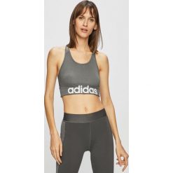 Adidas - Biustonosz. Szare biustonosze sportowe damskie Adidas, xs, z nadrukiem, z elastanu. W wyprzedaży za 89,90 zł.