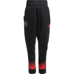 Spodnie chłopięce: adidas Performance STAR WARS Spodnie treningowe black/vivid red