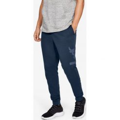 Under Armour Project Rock Terry Spodnie dresowe Niebieski. Niebieskie spodnie męskie Under Armour, s, bez wzorów, z bawełny, rockowe. Za 274,95 zł.