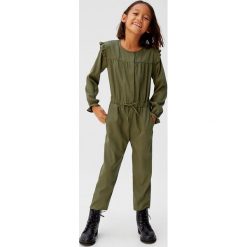 Mango Kids - Kombinezon dziecięcy Vega 110-164 cm. Żółte kombinezony dziewczęce Mango Kids, bez wzorów, z poliesteru, z długim rękawem, długie. W wyprzedaży za 59,90 zł.