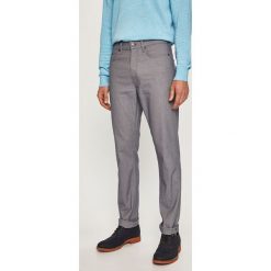 Calvin Klein - Spodnie. Szare spodnie męskie Calvin Klein, na co dzień, bez wzorów, z elastanu. W wyprzedaży za 379,90 zł.