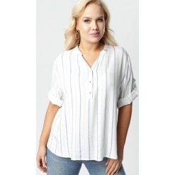 Biała Bluzka Tanianos. Białe bluzki damskie Born2be, xl, bez wzorów, z jeansu, ze stójką, plus size, z krótkim rękawem. Za 69,99 zł.