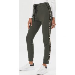 Khaki Spodnie Aewai. Brązowe spodnie damskie Born2be, uniwersalny, z dresówki. Za 119,99 zł.