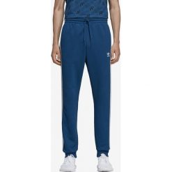 Adidas Originals Spodnie dresowe Niebieski. Niebieskie spodnie męskie adidas Originals, xxl, bez wzorów, z bawełny. Za 309,95 zł.