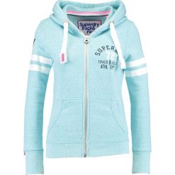 Superdry Bluza rozpinana bolt teal snowy. Niebieskie kardigany damskie Superdry, s, z bawełny. W wyprzedaży za 350,10 zł.