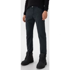 Spodnie slim fit - Granatowy. Niebieskie spodnie męskie House, s, bez wzorów. Za 129,99 zł.