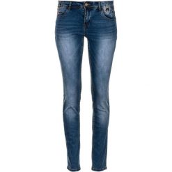 Desigual jeansy damskie Refriposas 26 niebieski. Niebieskie jeansy damskie Desigual, z jeansu. W wyprzedaży za 335,00 zł.