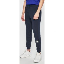 The North Face - Spodnie. Niebieskie spodnie męskie The North Face, na co dzień, s, bez wzorów, z bawełny, sportowe. W wyprzedaży za 279,90 zł.