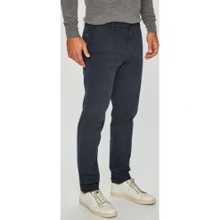 Tommy Hilfiger Tailored - Spodnie. Brązowe spodnie męskie Tommy Hilfiger Tailored, na co dzień, bez wzorów, z elastanu, casualowe. W wyprzedaży za 299,90 zł.