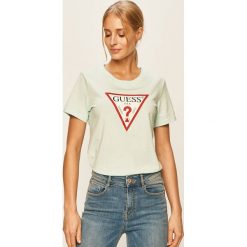 Guess Jeans - T-shirt. Żółte bluzki damskie Guess Jeans, s, z nadrukiem, z bawełny, casualowe, z okrągłym kołnierzem, z krótkim rękawem. W wyprzedaży za 119,90 zł.