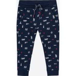 Coccodrillo - Spodnie dziecięce 56-62 cm. Niebieskie spodnie chłopięce COCCODRILLO, bez wzorów, z dzianiny, casualowe. Za 49,90 zł.