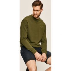 Russell Athletic - Bluza. Niebieskie bluzy męskie Russell Athletic, s, z aplikacjami, z bawełny, z kapturem, bez rękawów, z kapturem. W wyprzedaży za 239,90 zł.