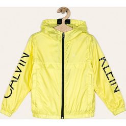 Calvin Klein Jeans - Kurtka dziecięca 116-176 cm. Żółte kurtki chłopięce Calvin Klein Jeans, bez wzorów, z poliesteru, krótkie, z kapturem. Za 449,90 zł.
