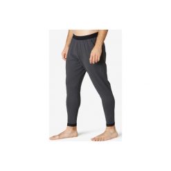 Spodnie dresowe Gym & Pilates 560 męskie. Szare spodnie męskie DOMYOS, m, bez wzorów, z elastanu. Za 119,99 zł.