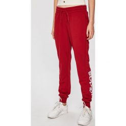 Adidas Performance - Spodnie. Czerwone spodnie damskie Adidas, s, z nadrukiem, z bawełny. Za 169,90 zł.