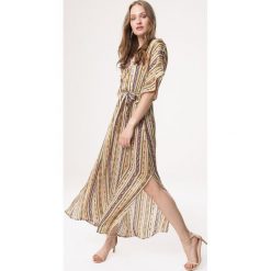 Żółta Sukienka Cante Flamenco. Żółte sukienki damskie Born2be, na plażę, s, bez wzorów, bez kołnierzyka, bez rękawów, maxi. Za 119,99 zł.