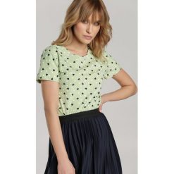 Miętowy T-shirt Kleorei. Zielone bluzki damskie Renee, s, bez wzorów, z tiulu, z okrągłym kołnierzem. Za 39,99 zł.