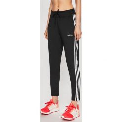 Adidas - Spodnie sportowe. Czarne spodnie damskie Adidas, s, bez wzorów, z poliesteru. W wyprzedaży za 169,90 zł.