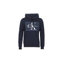 Bluzy Calvin Klein Jeans CHAMBRAY MONOGRAM HOODIE PATCH. Niebieskie bluzy męskie Calvin Klein Jeans, s, bez wzorów, z jeansu, bez kołnierzyka, bez rękawów, bez kaptura. Za 489,00 zł.