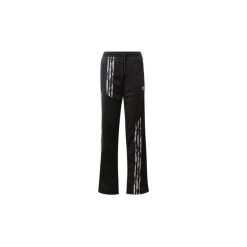 Spodnie treningowe adidas Daniëlle Cathari Firebird Track Pants. Czarne spodnie damskie Adidas. Za 379,00 zł.