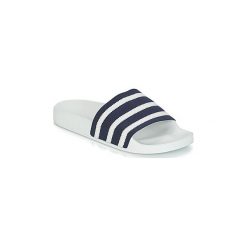 Klapki adidas ADILETTE. Niebieskie klapki damskie Adidas, bez wzorów, bez obcasa. Za 118,30 zł.
