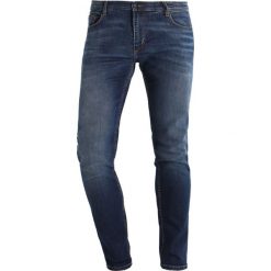 Jeansy męskie: Whyred SYD Jeans Skinny Fit mid indigo